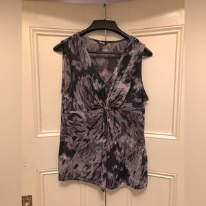 Stylish sleeveless blouse. Works great with slacks or jeans.